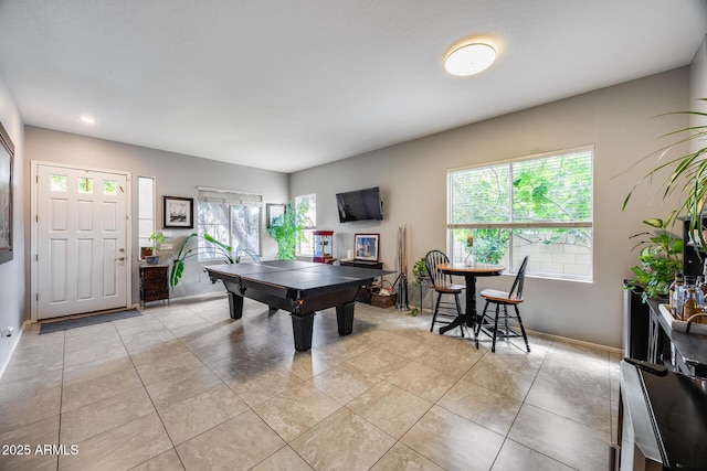 recreation room featuring pool table, baseboards, and light tile patterned flooring