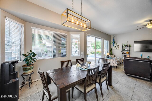 dining room featuring light tile patterned flooring and ceiling fan