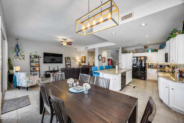 dining area featuring light tile patterned floors, ceiling fan, and recessed lighting