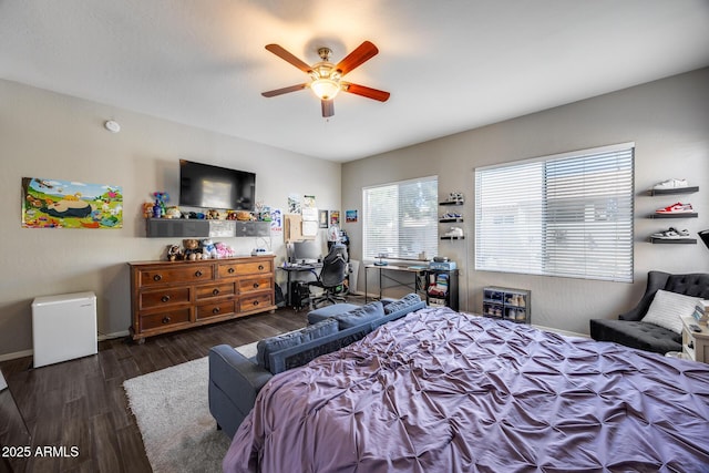 bedroom featuring wood finished floors, ceiling fan, and baseboards