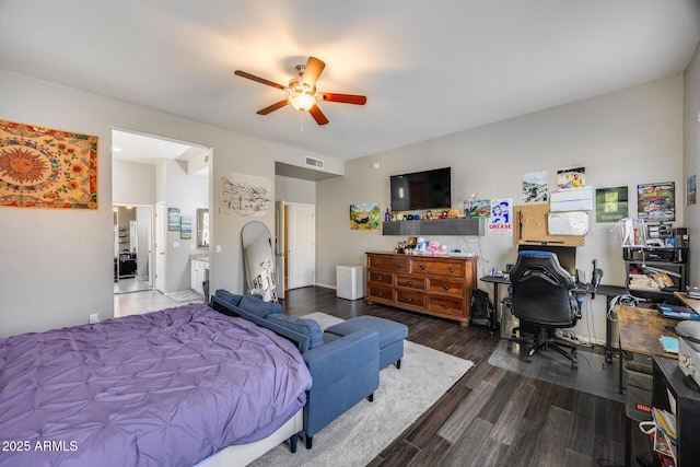 bedroom with wood finished floors, an office area, and ceiling fan
