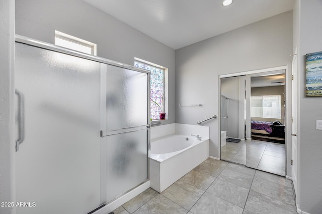 ensuite bathroom with a shower stall, a bath, tile patterned floors, and recessed lighting