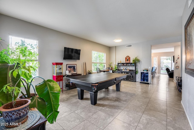 game room with wine cooler and light tile patterned floors