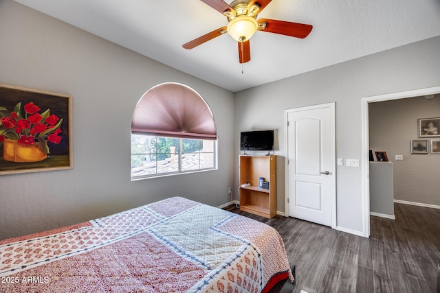 bedroom with wood finished floors, baseboards, and ceiling fan