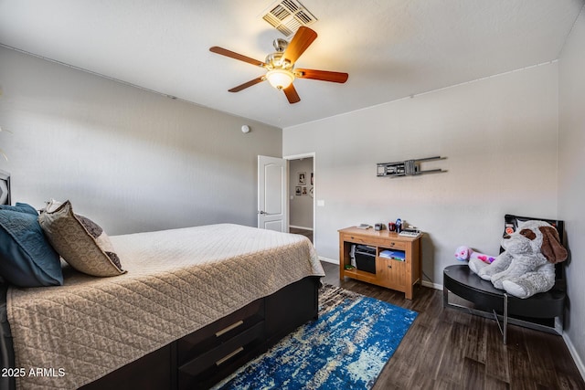 bedroom with baseboards, wood finished floors, and a ceiling fan