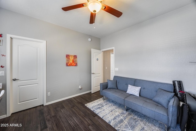 living room featuring wood finished floors, ceiling fan, and baseboards