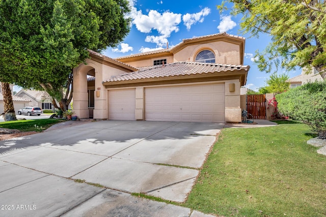 mediterranean / spanish-style house featuring stucco siding, driveway, a garage, a tile roof, and a gate