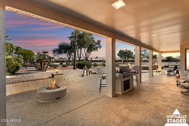 3507 N Snead Dr, Goodyear, AZ 85395 - view of patio / terrace featuring a fire pit