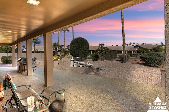 3507 N Snead Dr, Goodyear, AZ 85395 - patio terrace at dusk with a patio area and a fenced backyard