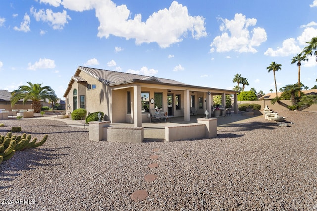 3507 N Snead Dr, Goodyear, AZ 85395 - back of property featuring stucco siding, a tile roof, and a patio