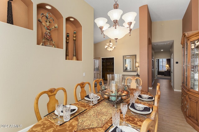 3507 N Snead Dr, Goodyear, AZ 85395 - dining space featuring a chandelier, wood finished floors, and baseboards