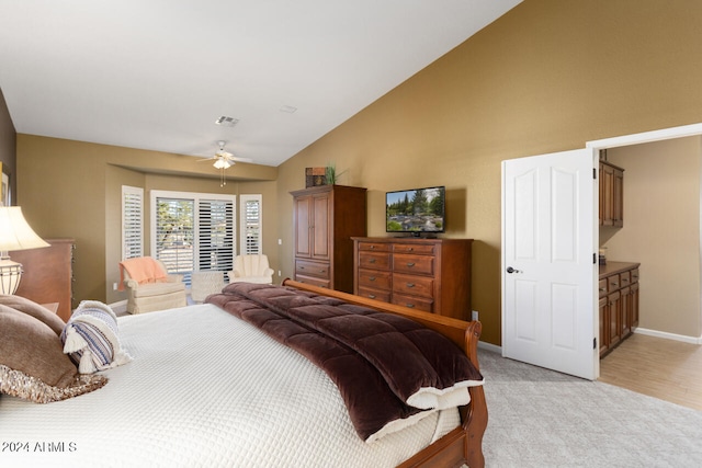 3507 N Snead Dr, Goodyear, AZ 85395 - bedroom with baseboards, light carpet, high vaulted ceiling, a ceiling fan, and access to exterior