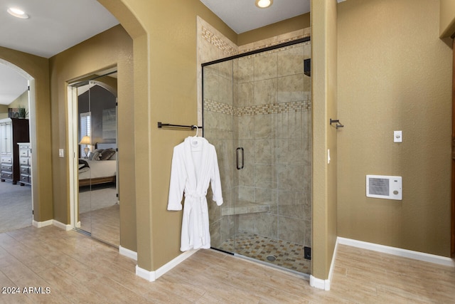 3507 N Snead Dr, Goodyear, AZ 85395 - full bathroom with wood finished floors, a stall shower, recessed lighting, and baseboards