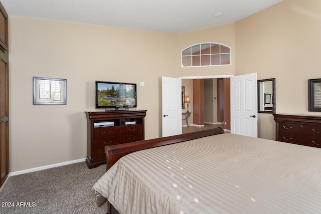 3507 N Snead Dr, Goodyear, AZ 85395 - bedroom with carpet floors, baseboards, and a towering ceiling