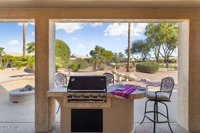 3507 N Snead Dr, Goodyear, AZ 85395 - view of patio / terrace featuring an outdoor fire pit and an outdoor bar