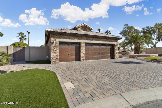 3507 N Snead Dr, Goodyear, AZ 85395 - garage with decorative driveway and a gate
