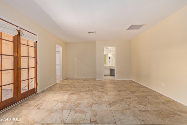 spare room with french doors