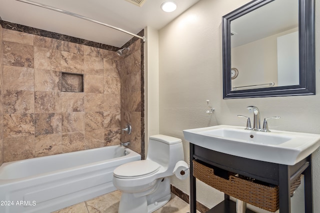 full bathroom featuring vanity, toilet, tile patterned floors, and tiled shower / bath