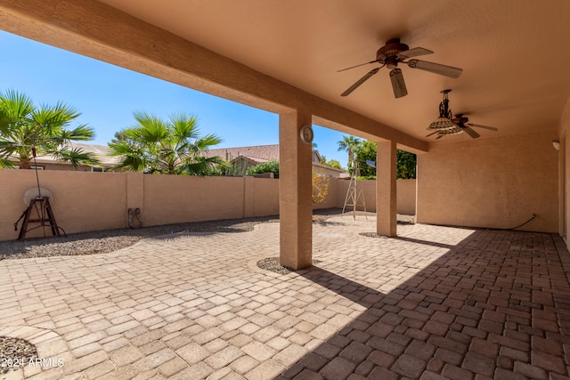 view of patio featuring ceiling fan