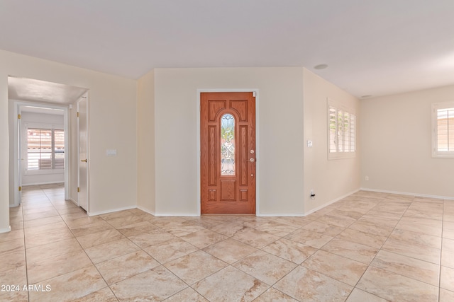 entrance foyer featuring plenty of natural light