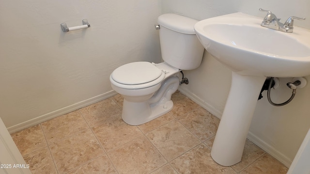 35005 N 30th Dr, Phoenix, AZ 85086 - half bathroom featuring tile patterned floors, toilet, and baseboards