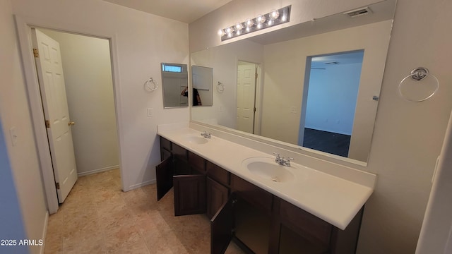 35005 N 30th Dr, Phoenix, AZ 85086 - full bath with double vanity, baseboards, visible vents, and a sink