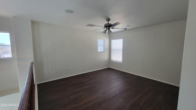 35005 N 30th Dr, Phoenix, AZ 85086 - spare room featuring dark wood finished floors, baseboards, visible vents, and ceiling fan