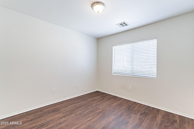 35005 N 30th Dr, Phoenix, AZ 85086 - empty room featuring dark wood finished floors, baseboards, and visible vents