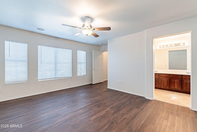 35005 N 30th Dr, Phoenix, AZ 85086 - unfurnished bedroom with ceiling fan, baseboards, ensuite bath, and dark wood-style flooring