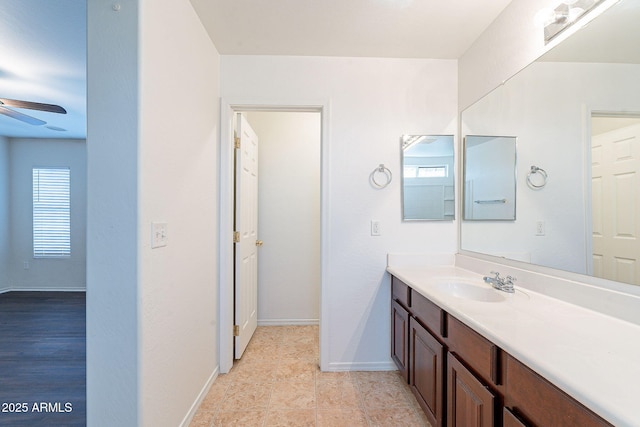 35005 N 30th Dr, Phoenix, AZ 85086 - bathroom featuring baseboards, ceiling fan, and vanity