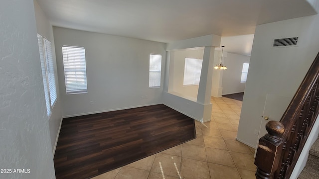 35005 N 30th Dr, Phoenix, AZ 85086 - unfurnished room featuring visible vents, baseboards, a notable chandelier, and tile patterned flooring