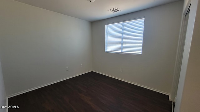 35005 N 30th Dr, Phoenix, AZ 85086 - empty room featuring visible vents, baseboards, and dark wood finished floors