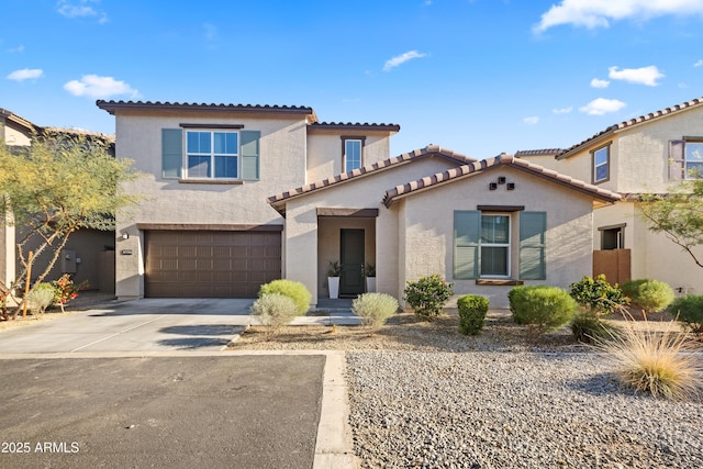 mediterranean / spanish-style house featuring a garage