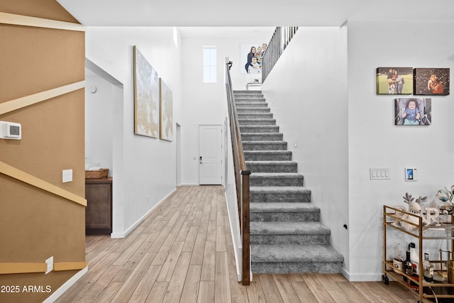 stairs featuring hardwood / wood-style flooring