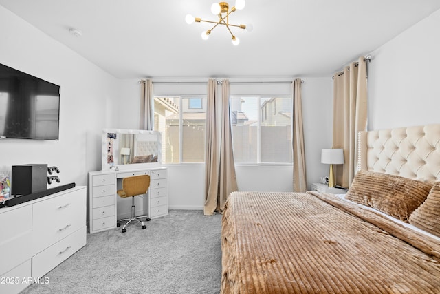 carpeted bedroom with an inviting chandelier