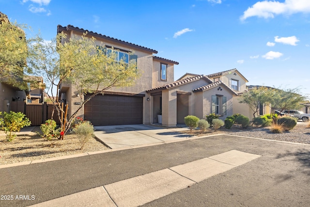 mediterranean / spanish-style home with a garage