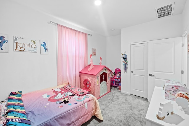 carpeted bedroom featuring a closet