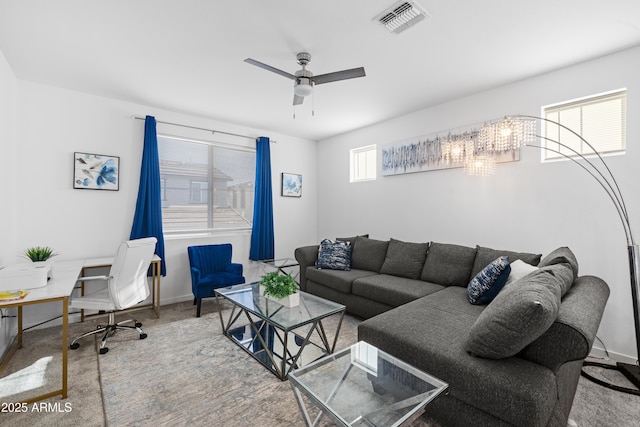 living room with carpet and ceiling fan