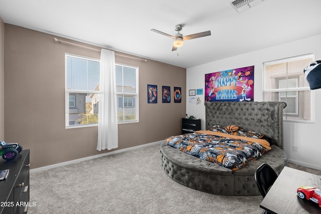 bedroom with ceiling fan and carpet flooring