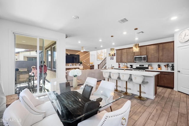 interior space with sink and ceiling fan