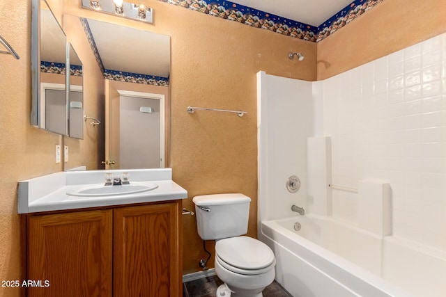 full bathroom featuring toilet, vanity, and shower / bathing tub combination