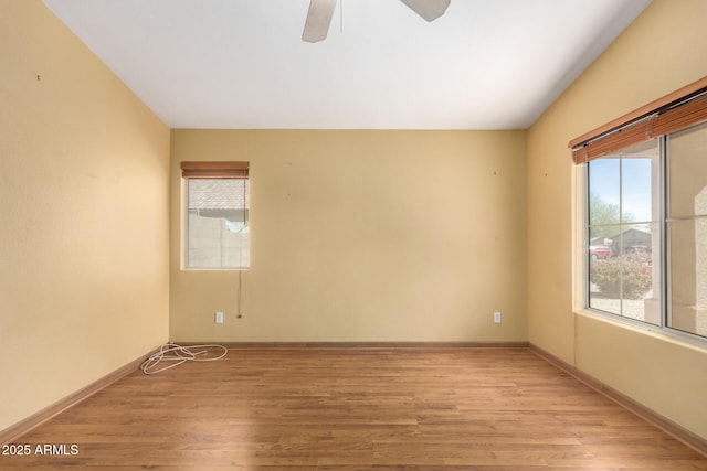 spare room featuring ceiling fan and light wood-type flooring