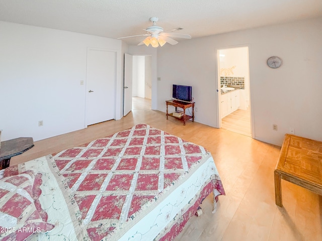 bedroom featuring connected bathroom and visible vents