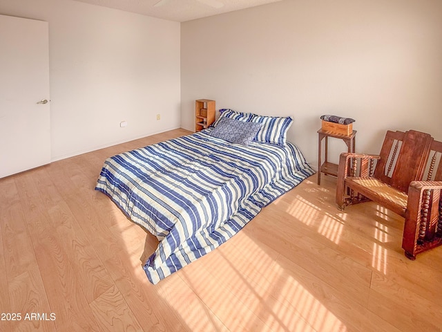 bedroom featuring wood finished floors