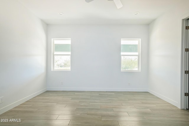 empty room featuring ceiling fan and light wood-type flooring