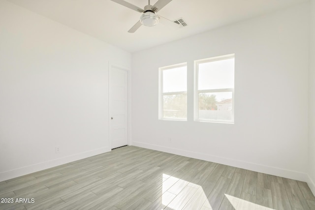 unfurnished room with ceiling fan and light hardwood / wood-style floors