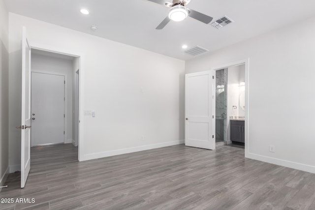 unfurnished room featuring ceiling fan and wood-type flooring