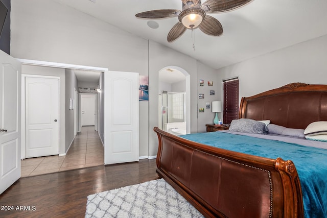 bedroom featuring wood-type flooring, ceiling fan, and ensuite bathroom