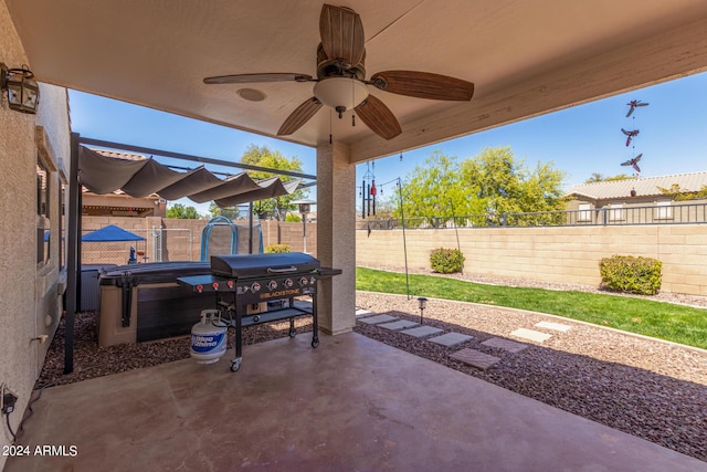 view of patio featuring a grill and ceiling fan