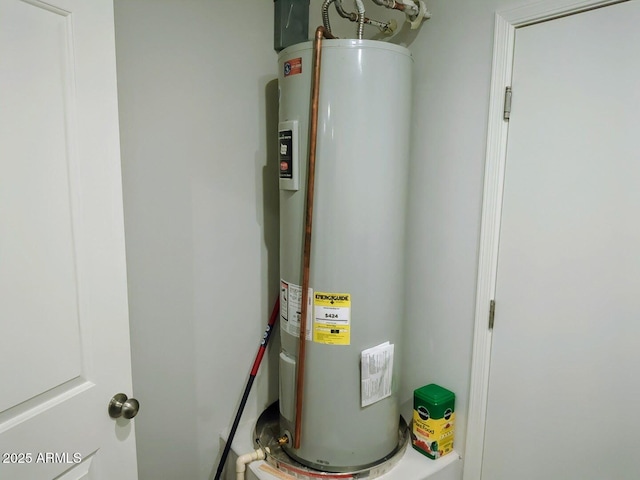 utility room with electric water heater